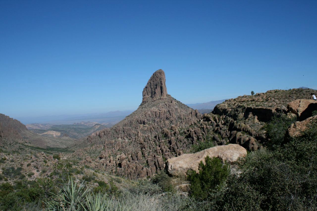 Weavers Needle is a 1,000-foot-high column of rock that forms a distinctive peak visible for many miles around.